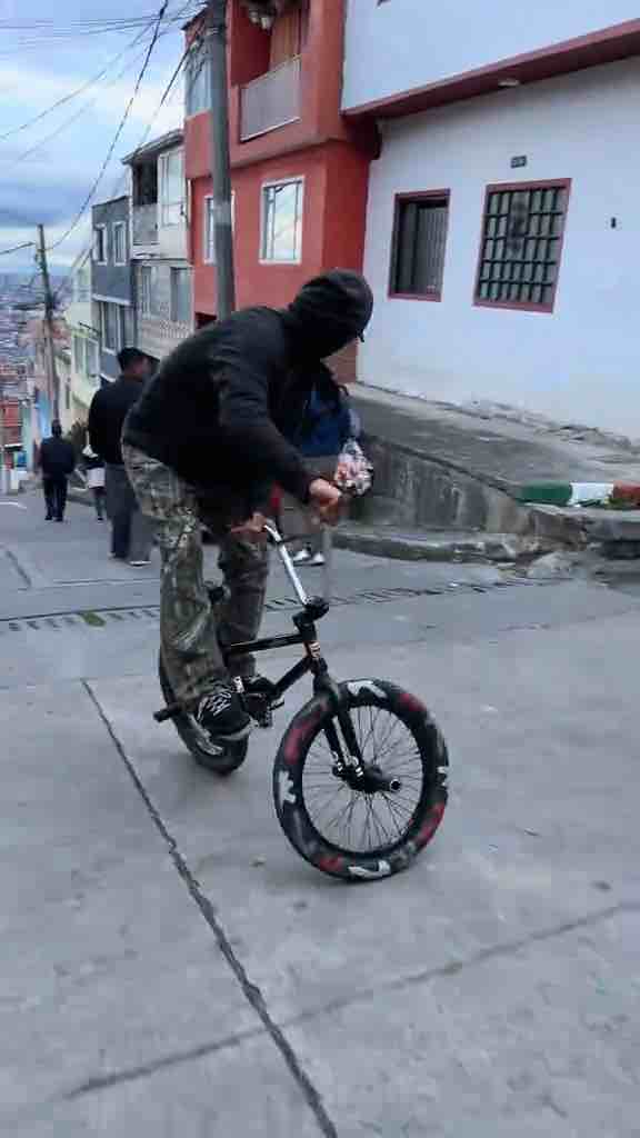 Riding BMX bike backwards down a hill in Bogotá, Colombia