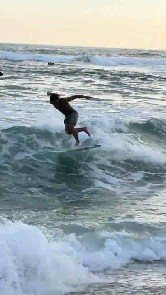 Surfing on a beach with hot chicks