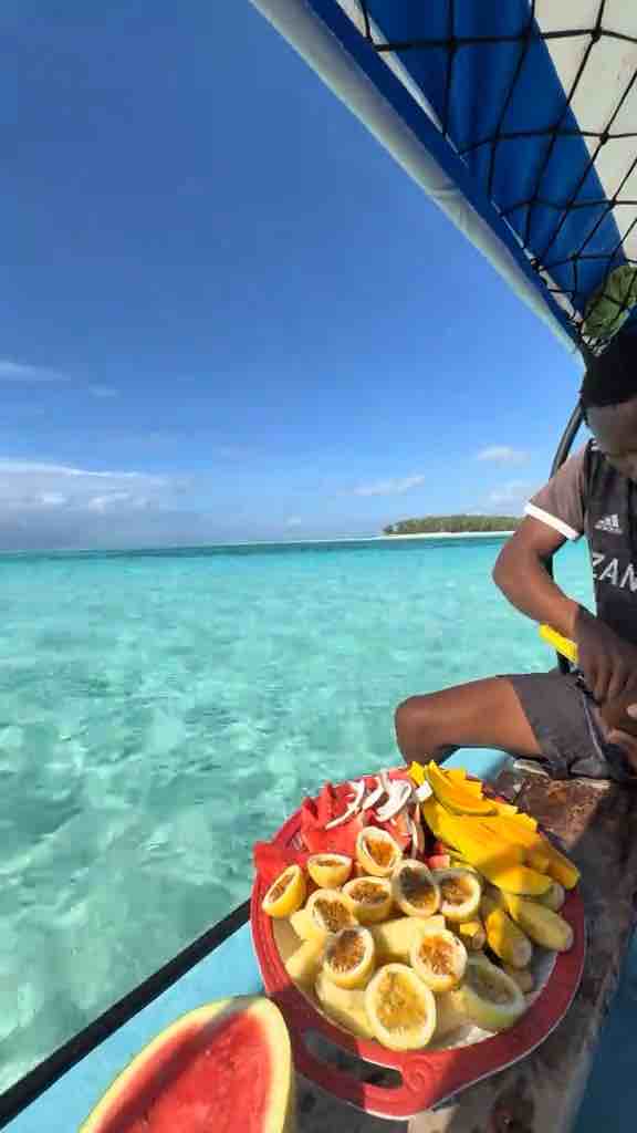 On the clear blue waters of Zanzibar cutting fruits and chillin’